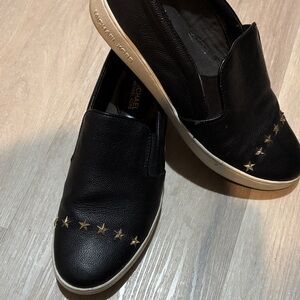 Michael Kors Black Slip-Ons with Gold Star Details size 10